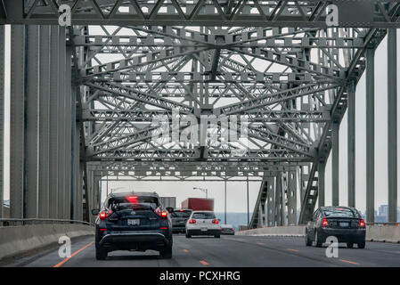 Burlington, Ontario, Canada.  Steel bridge truss of James N. Allan Skyway over Burlington Bay, northbound on QEW highway during afternoon rush hour. Stock Photo