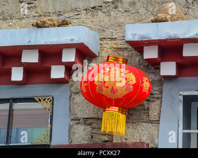 Daocheng, China - Aug 15, 2016. A red lantern for decoration at traditional house in Daocheng, China. Stock Photo
