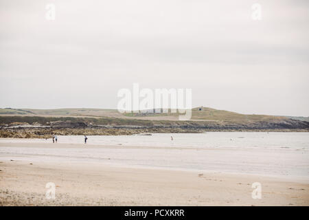 Broad Beach (Traeth Llydan) with the burial mound in the distance, Anglesey, North Wales, UK Stock Photo