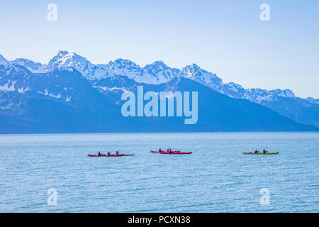 Ocean kayakers in Resurrecton in Bay off Lowell Point in Seward Alaska Stock Photo