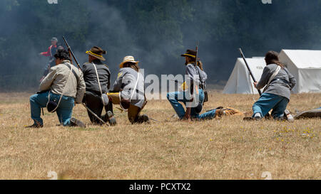 Duncan Mills, CA - July 14, 2018: Battle field featuring confederate fighters during the Civil War Days. This is is one of the largest reenactment eve Stock Photo