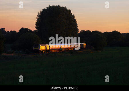 A First Great western  Railway high speed train ( Intercity 125) glinting in the sun set near Crofton heading west on the Berks and Hants line Stock Photo