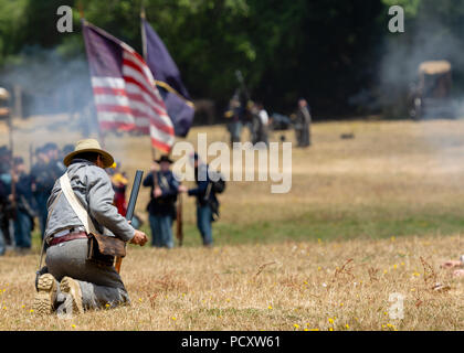 Duncan Mills, CA - July 14, 2018: Confederate soldier being shot by union army the battlefield of. the Civil War Days. This is one of the largest reen Stock Photo