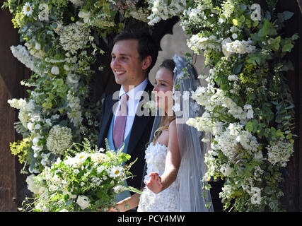 Daisy Jenks and Charlie van Straubenzee outside St Mary the Virgin Church in Frensham, Surrey, after their wedding ceremony. Stock Photo