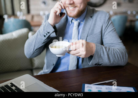 Man drinking tea during work Stock Photo