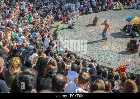 Large crowd gathered at Mauerpark's amphitheater in Berlin, Germany, watching one of the famous Sunday karaoke sessions. Stock Photo