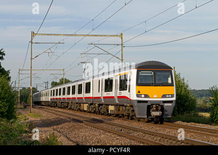 Refurbished ‘Renatus’ class 321 number 321314 plus un-refurbished 321335 forms a Greater Anglia service at Margaretting on the 1st August 2018.  Refur Stock Photo