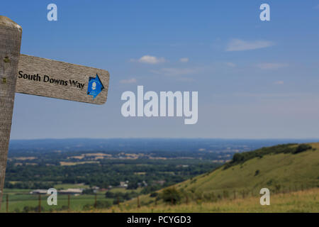 A signpost on the South Downs Way, a national trail, high on the South Downs at Ditchling Beacon, near Brighton Stock Photo