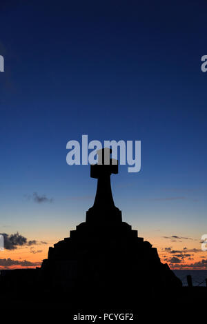 The War Memorial in Newquay, Cornwall, in silhouette against a late summer's sunset Stock Photo