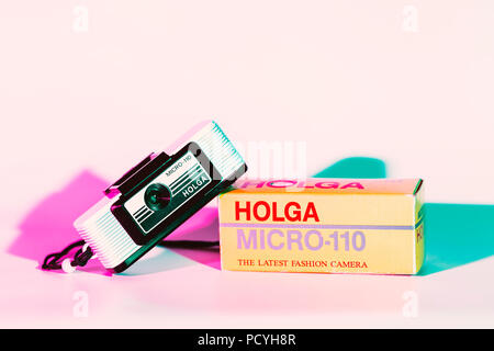 CHONBURI, THAILAND - August, 2018 : Holga micro 110 camera and the box, Used color plate cover flash for pink and soft blue color shade. Stock Photo
