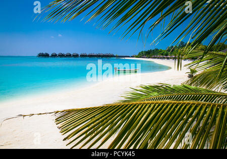 Beautiful beach with white sand at tropical Olhuveli island, south Male Atoll, Maldives. Stock Photo