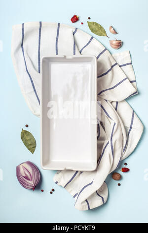 Empty ceramic baking tray and spice set. Cooking concept. Stock Photo