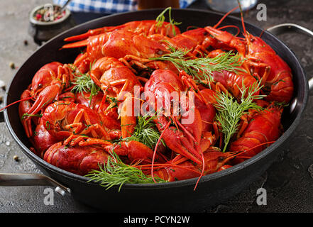 Crayfish. Red boiled crawfishes on table in rustic style, closeup. Lobster closeup. Border design Stock Photo