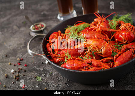 Crayfish. Red boiled crawfishes on table in rustic style, closeup. Lobster closeup. Border design Stock Photo