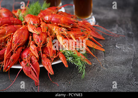 Crayfish. Red boiled crawfishes on table in rustic style, closeup. Lobster closeup. Border design Stock Photo
