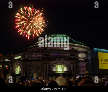 Fireworks over Usher Hall from Edinburgh Military Tattoo as crowd waits for opening event of EIF, Five Telegrams, Edinburgh, Scotland, UK Stock Photo
