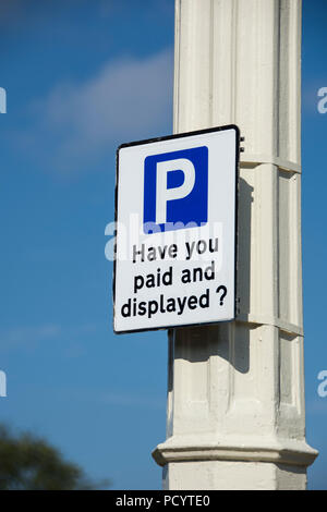 Parking signs and machines on streets of Southport Stock Photo