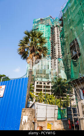 Partly completed new apartment block construction site in the Slave Island district of Colombo, capital city of Sri Lanka Stock Photo
