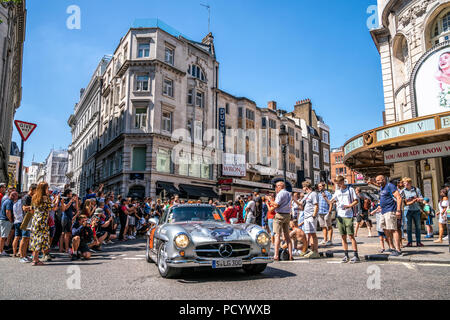 5 August 2018 - London, England. People taking pictures of an old classical Mercedes Sl car at Gumball Rally 3000 event. Stock Photo