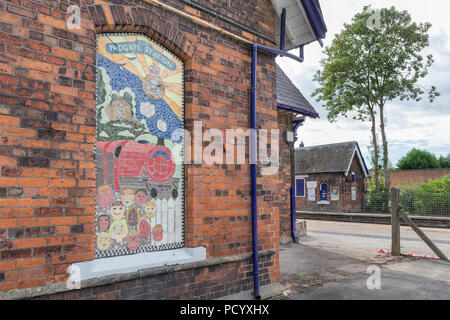 A no longer used window has been decoratively pictured with a mosaic of The Christchurch Express train at the Historic Railway Station of Padgate, War Stock Photo