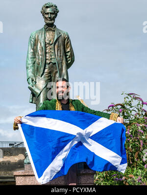 Henry Box Brown Musical, Fringe Festival, Abraham Lincoln Memorial, Old Calton Burial Ground,  Edinburgh, Scotland, UK, with man holding saltire flag Stock Photo