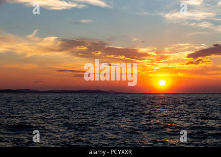 Zadar, Croatia - July 23, 2018: Sunset over the island of Ugljan seen from Zadar Stock Photo