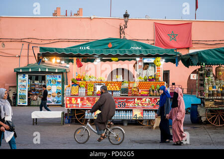 Marrakesh, Morocco - November 08, 2017: Fruits seller on Moroccan market square Jamaa el Fna in Marrakesh medina quarter, called also Jemaa el-Fnaa, D Stock Photo