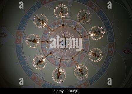 Looking up at an impressive chandelier at Culzean Castle (chandelier from below) on a ceiling designed by Robert Adam. Stock Photo