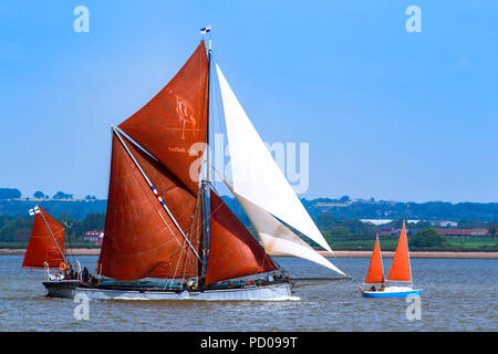 Thames sailing barge Xylonite overhauls a smaller craft on the Blackwater. Stock Photo