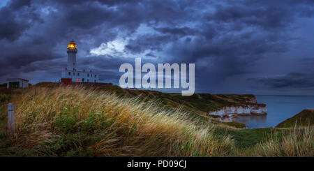 A rainstorm moves in towards Flamborough Head at twilight. Stock Photo