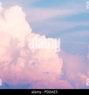 Clouds in the sky before sunset. Neon and blue trend colors. Stock Photo