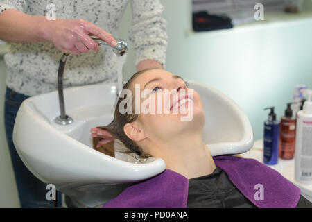 happy young woman at hairdresser Stock Photo