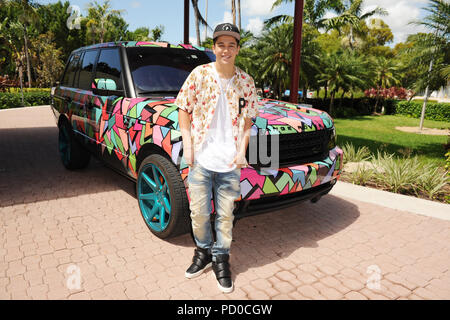 MIAMI BEACH FL - JUNE 18: DJ Irie and Austin Mahone attend the Inspire Kids Golf Clinic during The 11th Annual Irie Weekend at the Miami Beach Golf Club on JUNE 18, 2015 in Miami Beach, Florida   People:  Austin Mahone Stock Photo