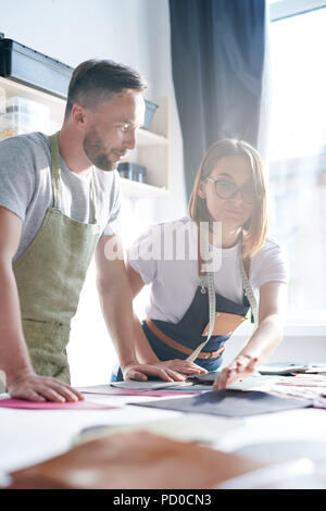 Working in team to create leather products Stock Photo