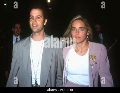 BEVERLY HILLS, CA - JUNE 3: (L-R) Actor Christopher Peters and actress Sharon Stone attend Paramount Pictures 'Patriot Games' Premiere on June 3, 1992 at the Academy of Motion Pictures Arts and Sciences Theatre in Beverly Hills, California. Photo by Barry King/Alamy Stock Photo Stock Photo