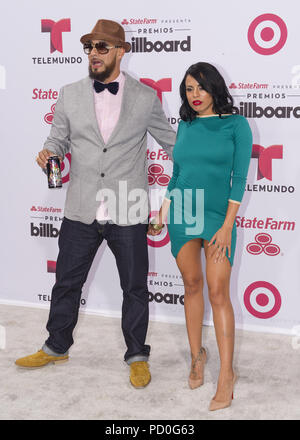 MIAMI, FL - APRIL 30:  Don Dinero and Luna Star arrives at 2015 Billboard Latin Music Awards presented by State Farm on Telemundo at Bank United Center on April 30, 2015 in Miami, Florida   People:  Don Dinero and Luna Star Stock Photo