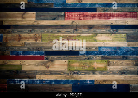 Wall made of multi-colored wooden boards. Abstract grunge wood texture background Stock Photo