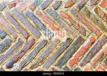 Old bricks in pattern on a street Stock Photo