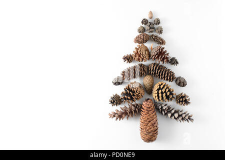 Fir-tree made of cones various coniferous trees isolated on white, view from above. Free copy space. Stock Photo