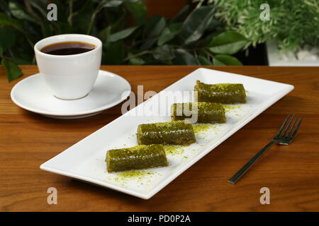 Pistachio rolls baklava,Fistik sarma, Turkish traditional dessert Stock Photo