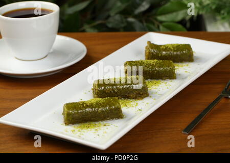 Pistachio rolls baklava,Fistik sarma, Turkish traditional dessert Stock Photo