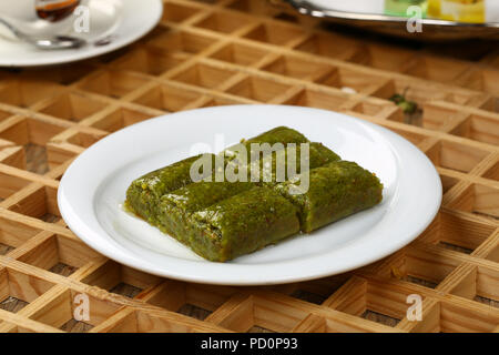 Pistachio rolls baklava,Fistik sarma, Turkish traditional dessert Stock Photo