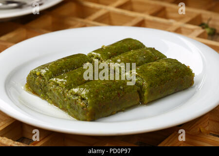 Pistachio rolls baklava,Fistik sarma, Turkish traditional dessert Stock Photo