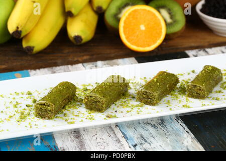 Pistachio rolls baklava,Fistik sarma, Turkish traditional dessert Stock Photo