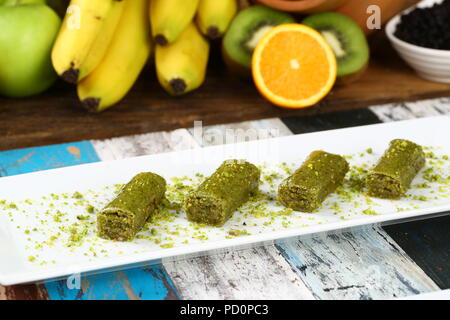 Pistachio rolls baklava,Fistik sarma, Turkish traditional dessert Stock Photo