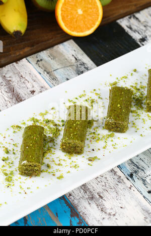 Pistachio rolls baklava,Fistik sarma, Turkish traditional dessert Stock Photo