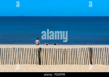 Sunbathing on the beach at Chatelaillon Plage near La Rochelle in the Charente-Maritime department of southwest France. Stock Photo