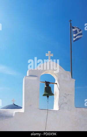 Cycladic greek orthodox church on Paros island, Greece. White cross against blue sea and sky Stock Photo