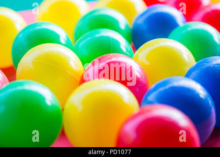 close-up of various colored balls with blurred background. Useful as a background to advertise children's games. Horizontal view Stock Photo