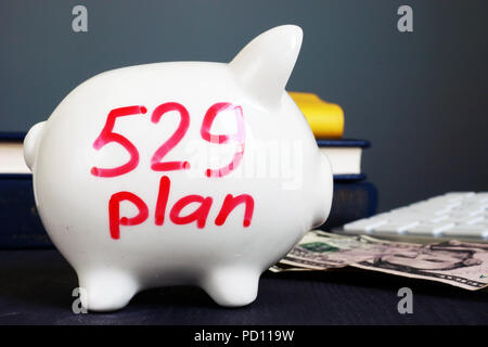 529 plan written on a piggy bank. College savings plan. Stock Photo